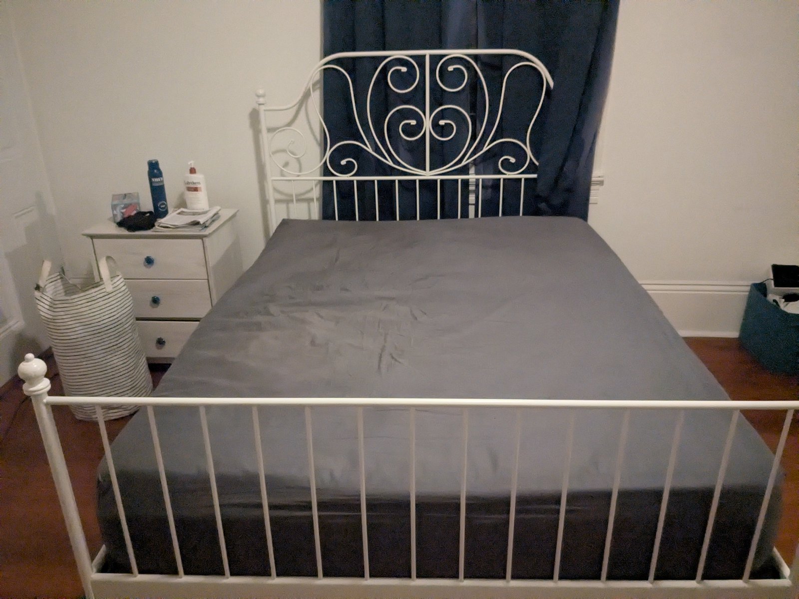 IKEA LEIRVIK Queen bed frame — white metal, ornate scrollwork headboard